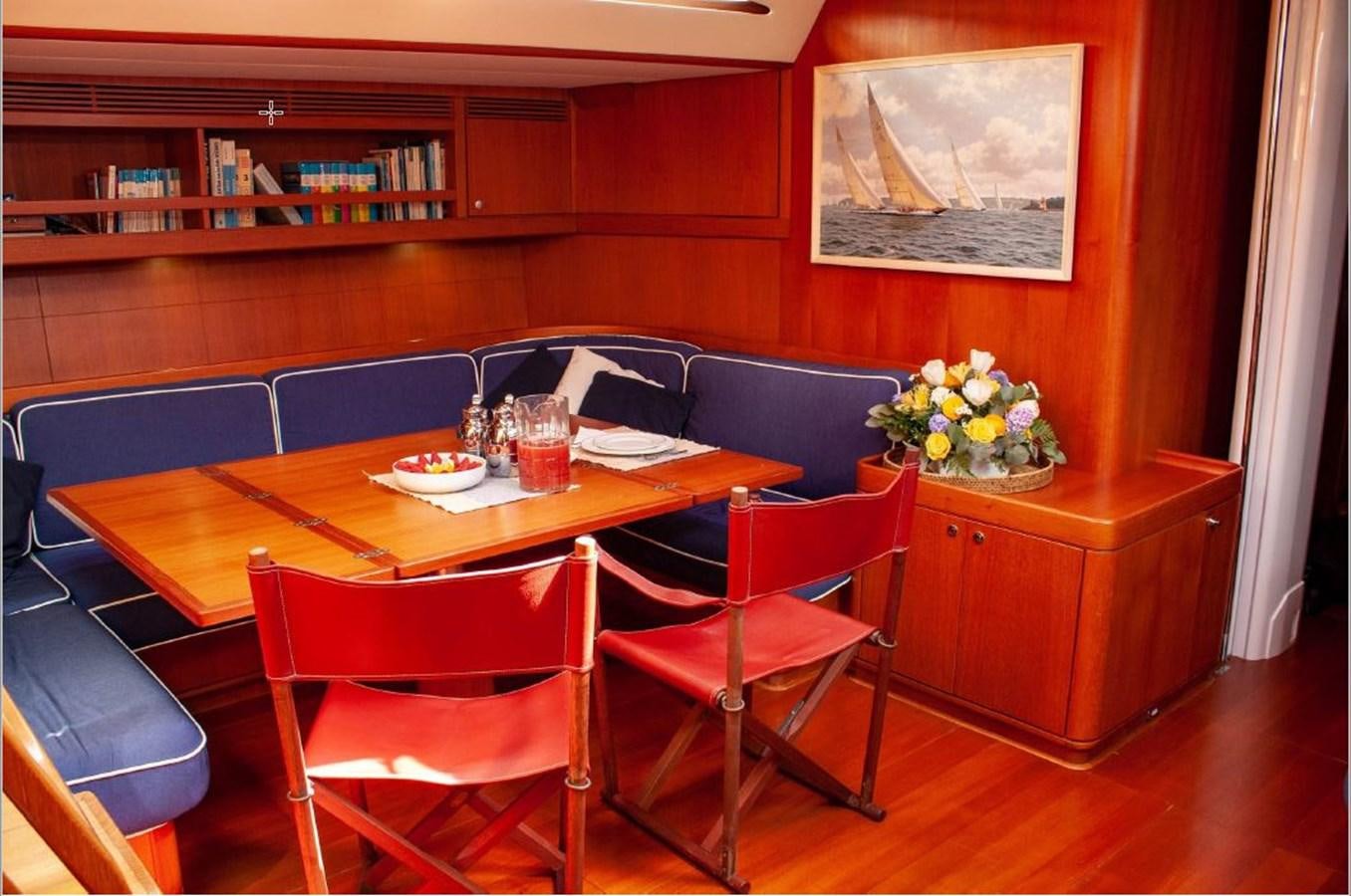 a room with a table and chairs aboard NAUTA-PETERSON 75 Yacht for Sale