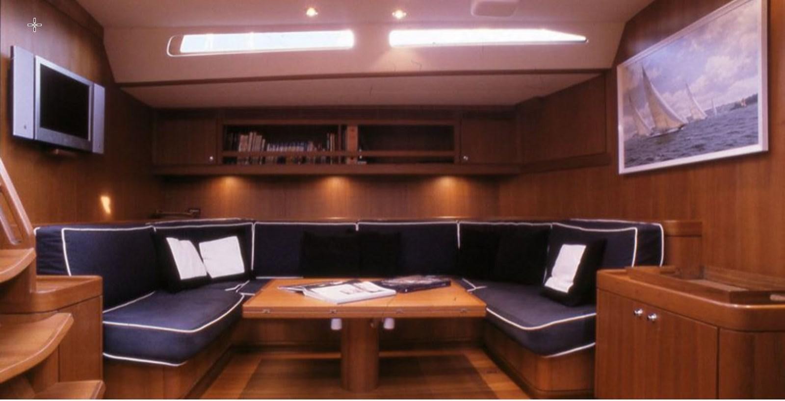 a room with a couch and a table aboard NAUTA-PETERSON 75 Yacht for Sale
