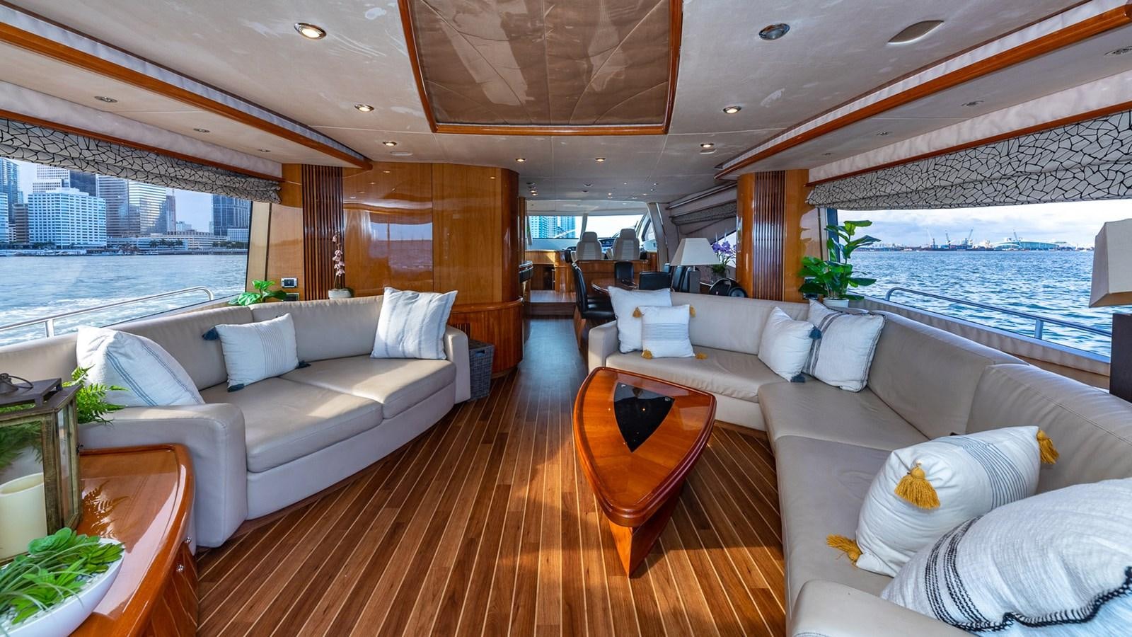 a living room with a large window aboard ICONIC Yacht for Sale