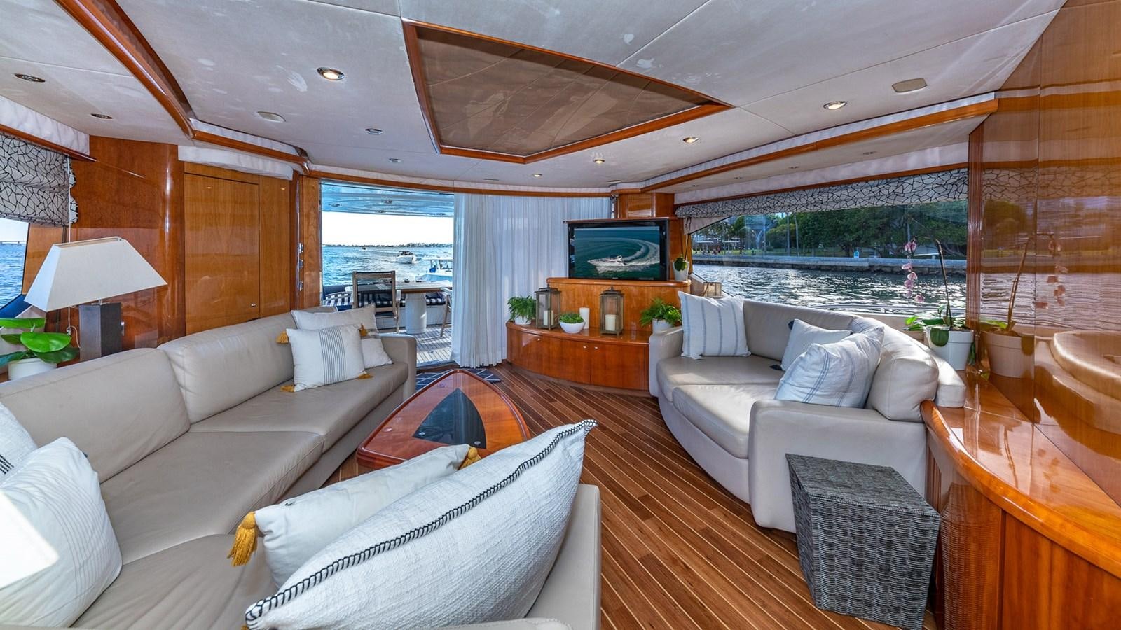 a living room with a large window aboard ICONIC Yacht for Sale