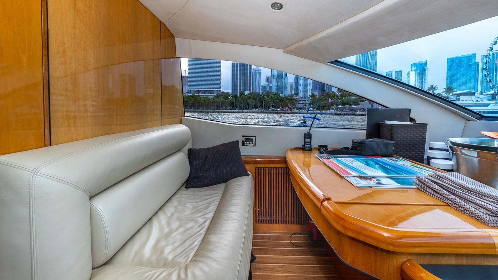 a room with a couch and a table aboard ICONIC Yacht for Sale