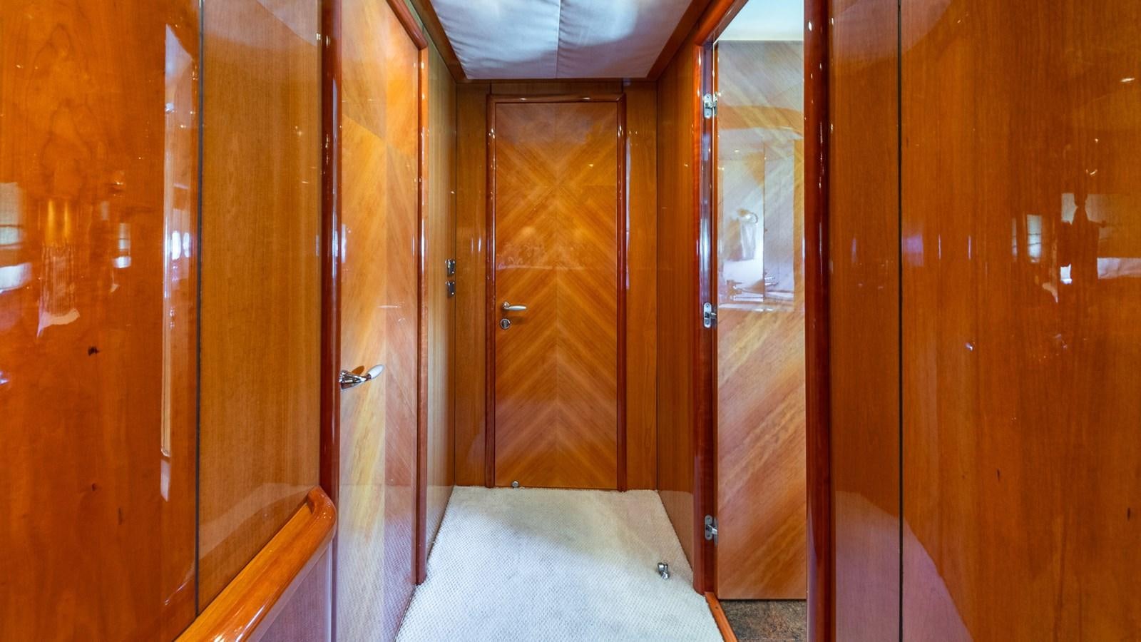 a room with wooden doors aboard ICONIC Yacht for Sale
