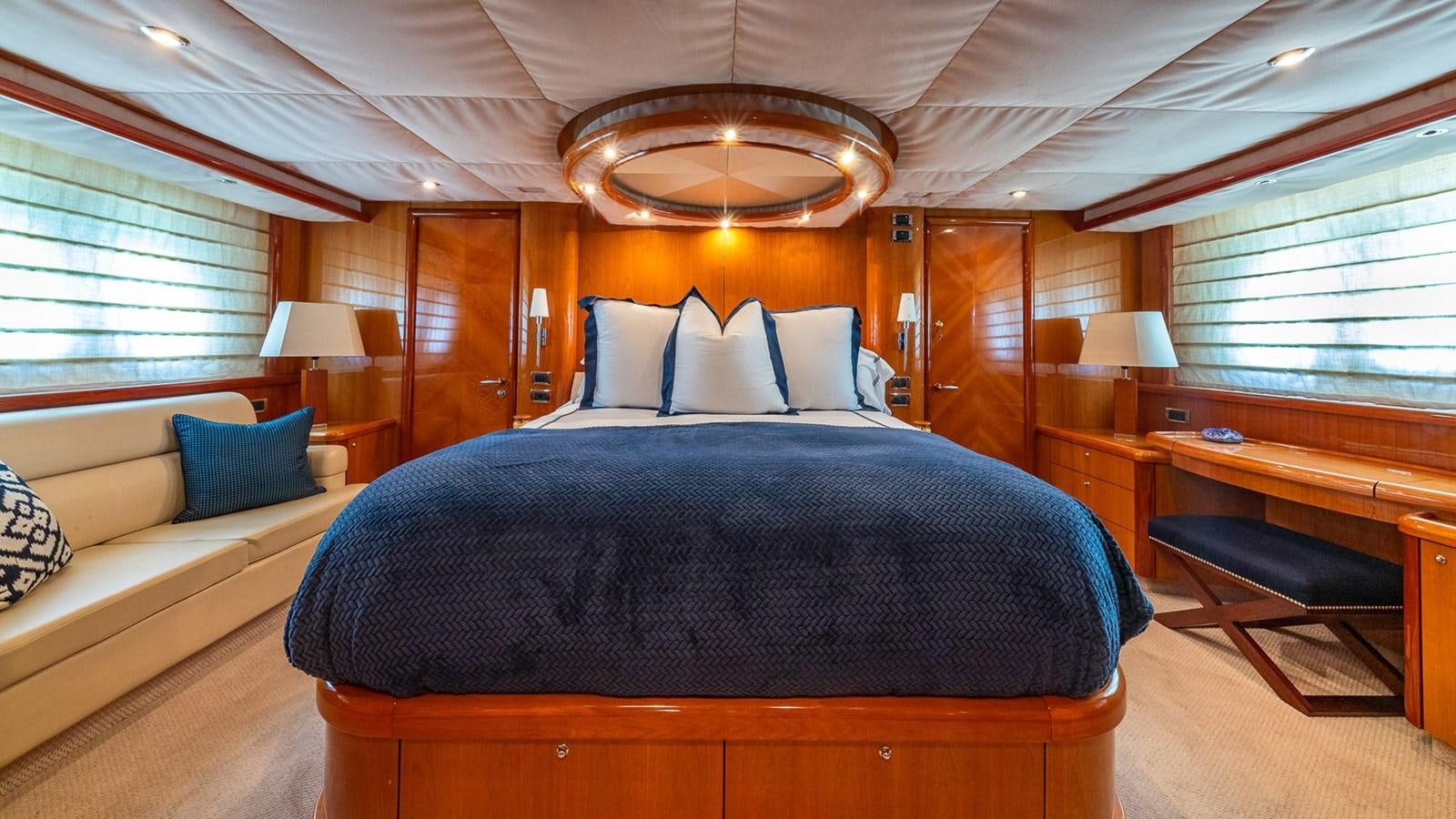 a bed in a room aboard ICONIC Yacht for Sale