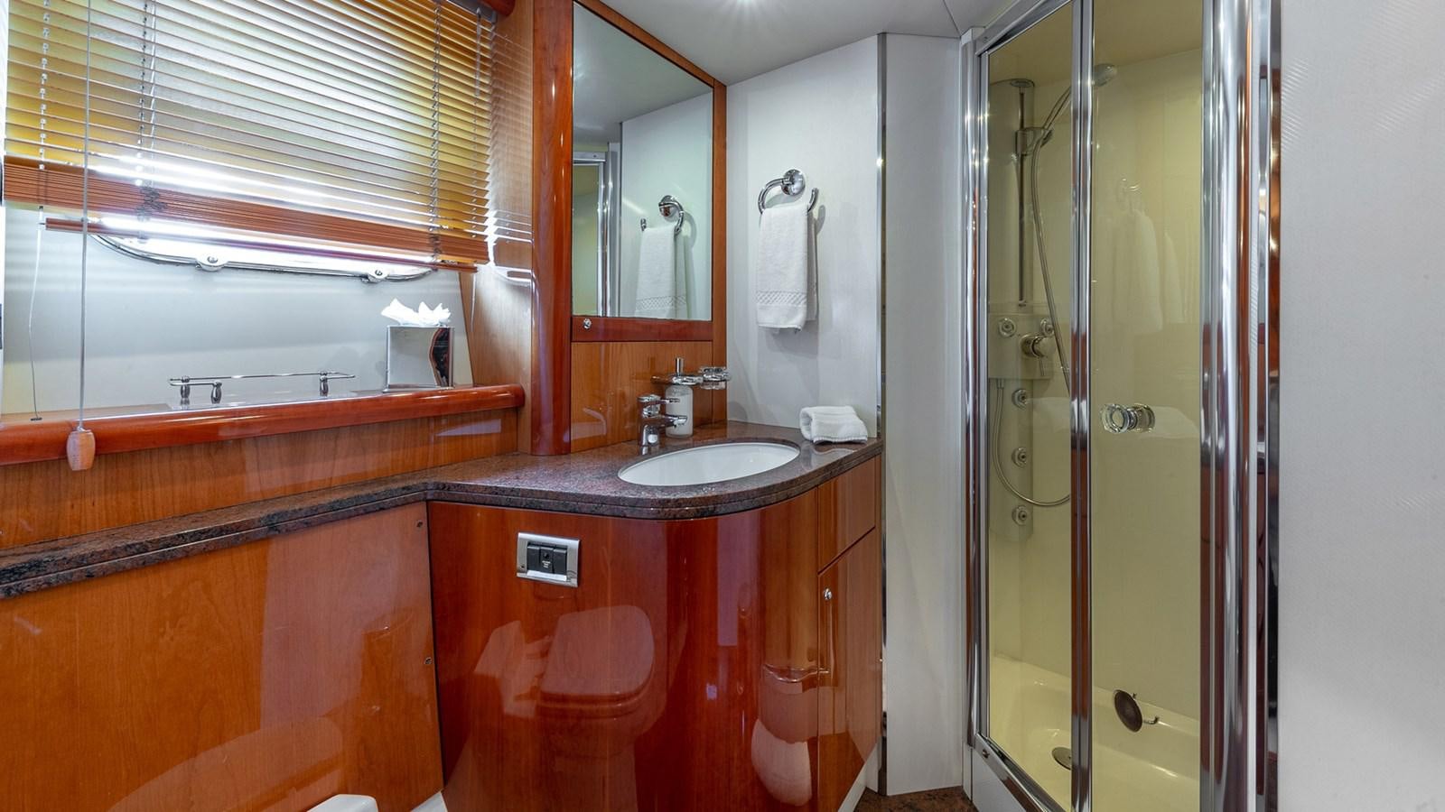 a bathroom with a sink and a mirror aboard ICONIC Yacht for Sale