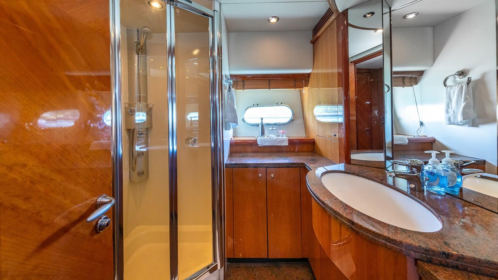 a bathroom with a sink and a shower aboard ICONIC Yacht for Sale
