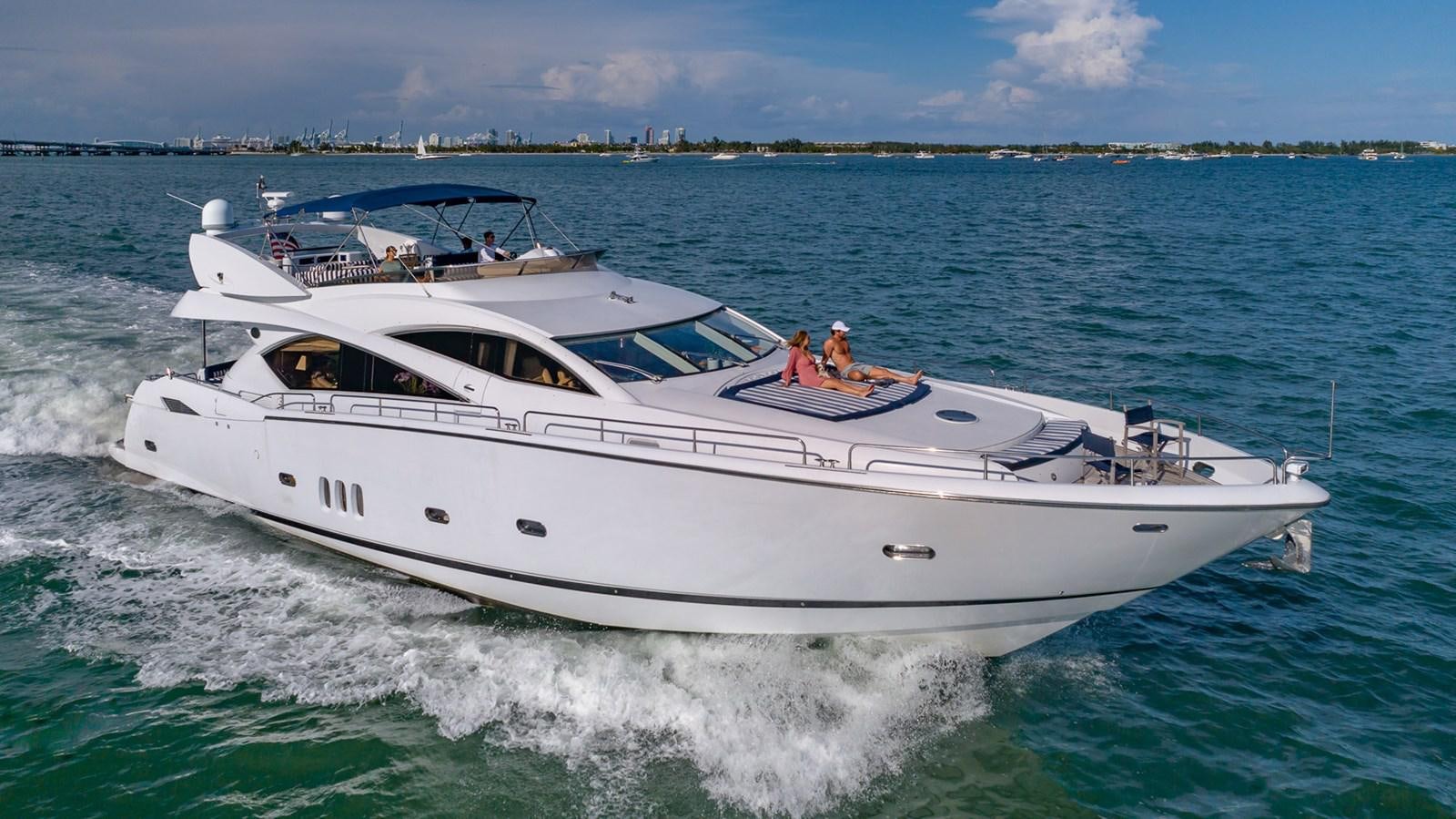 a white boat on the water aboard ICONIC Yacht for Sale