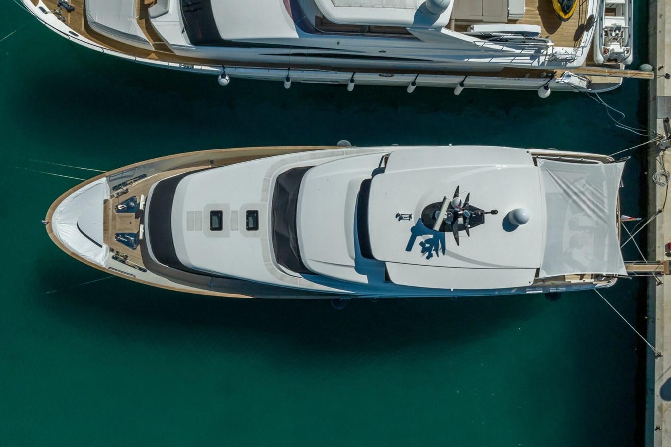 a white boat with a blue stripe aboard SANLORENZO SD 92 Yacht for Sale