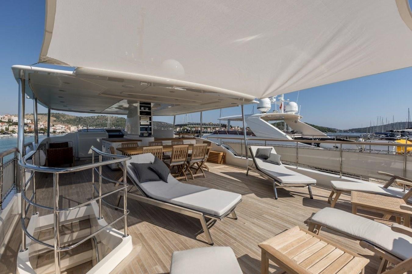 a deck with a view of the water and a plane aboard SANLORENZO SD 92 Yacht for Sale