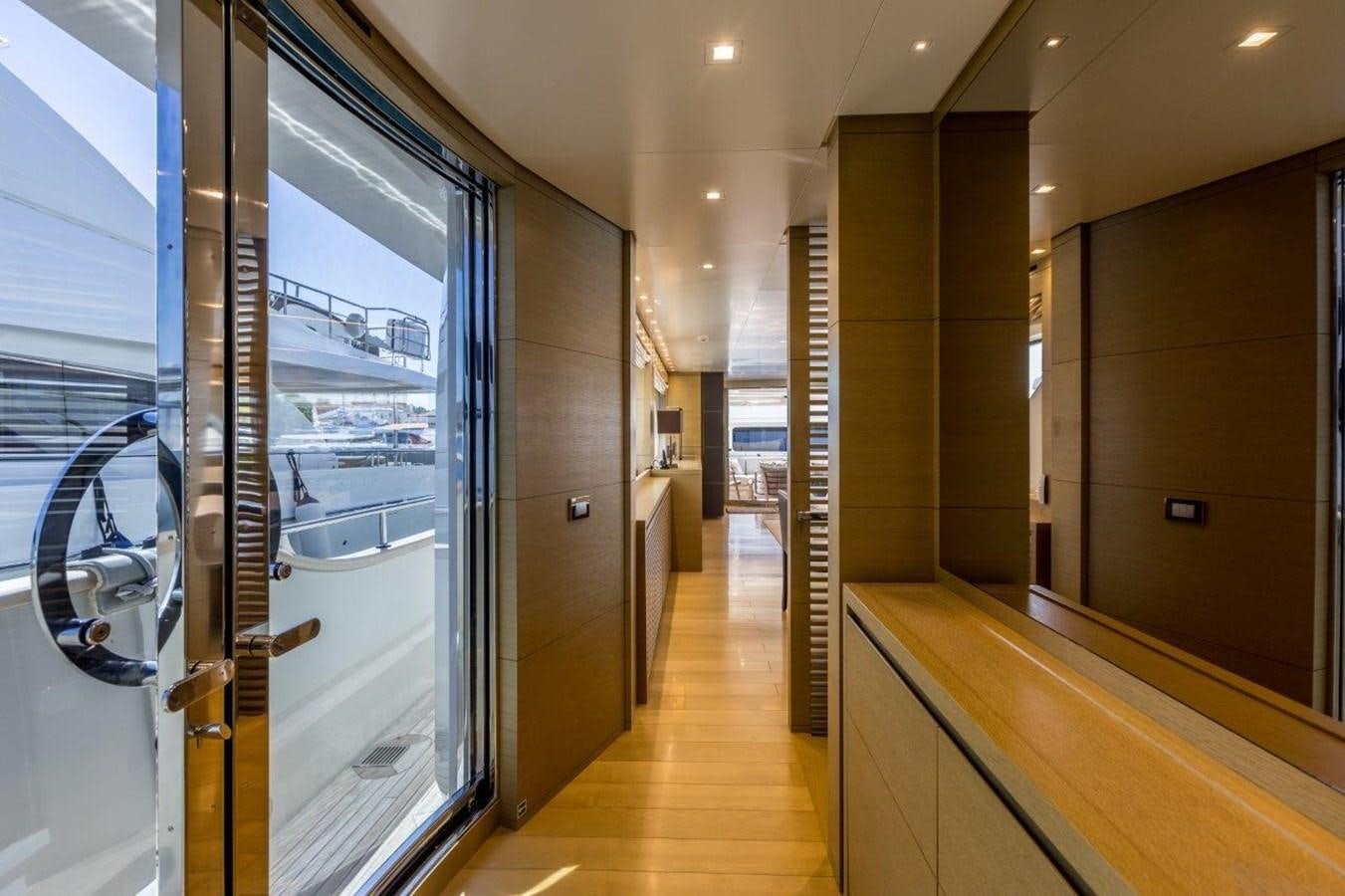 a hallway with glass doors aboard SANLORENZO SD 92 Yacht for Sale