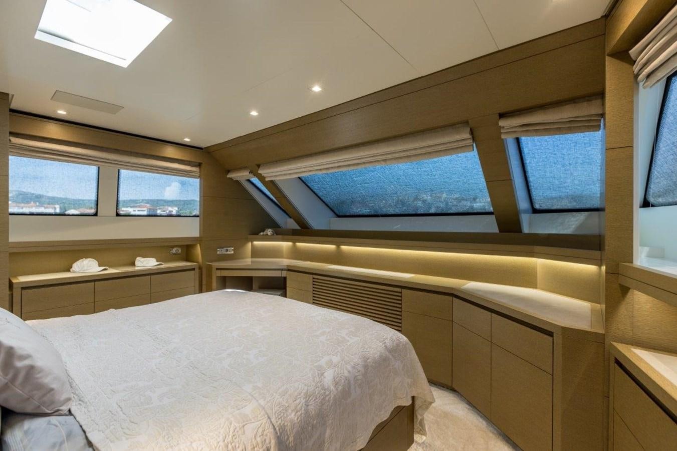 a room with a bed and a window aboard SANLORENZO SD 92 Yacht for Sale