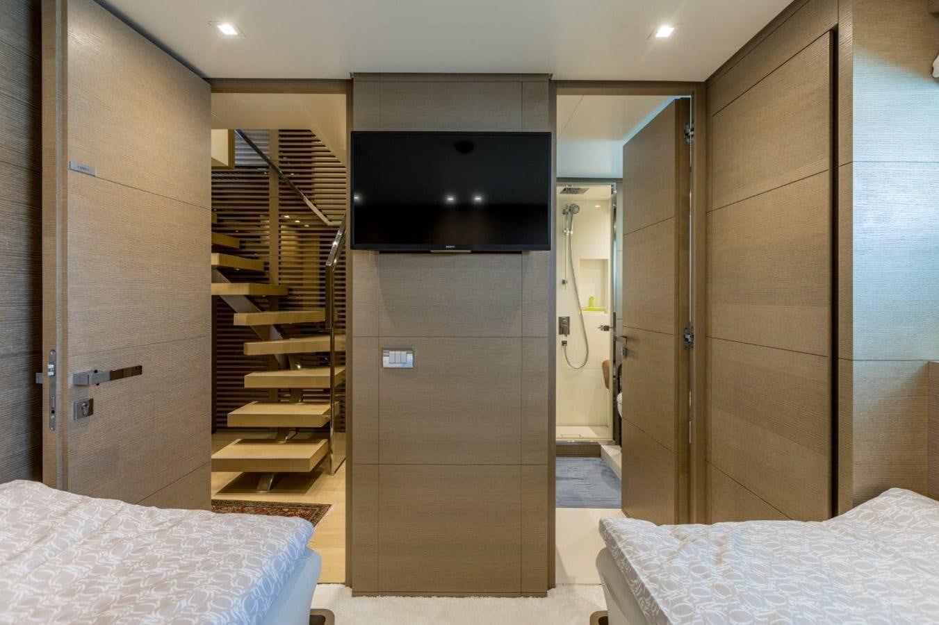 a room with a bed and a tv aboard SANLORENZO SD 92 Yacht for Sale