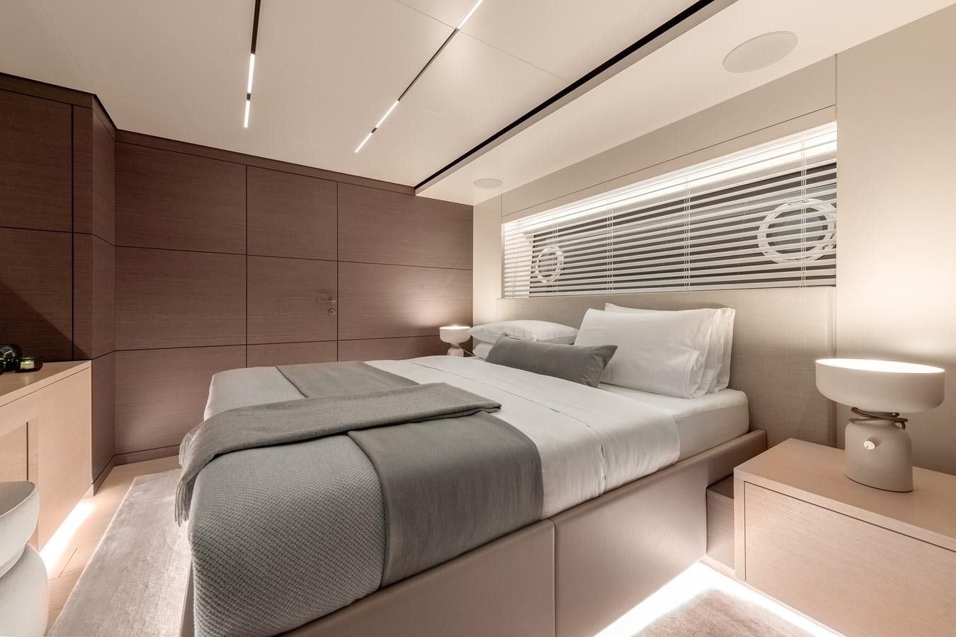 a room with a bed and a table aboard PALOMA Yacht for Sale