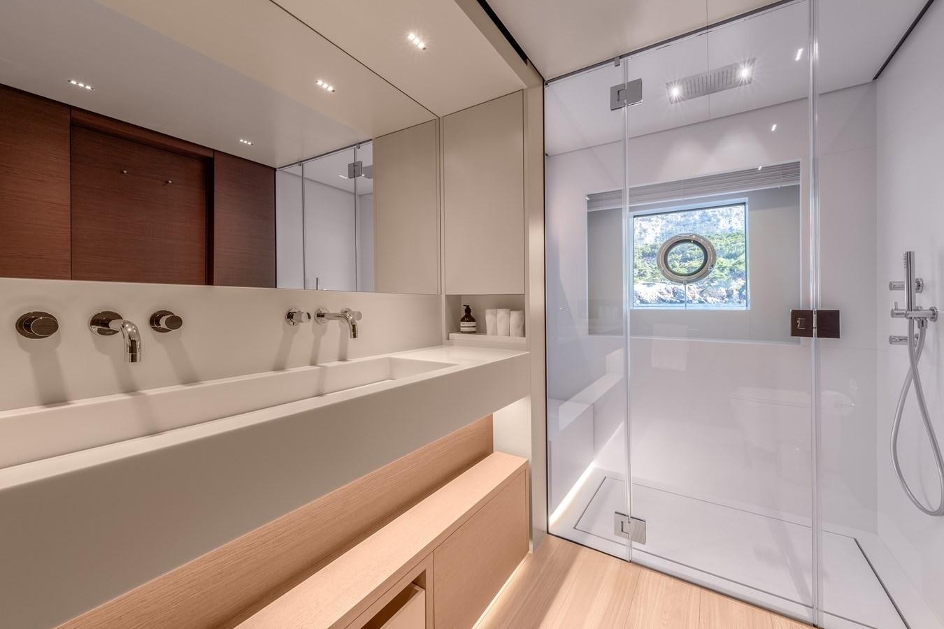 a bathroom with a large mirror aboard PALOMA Yacht for Sale