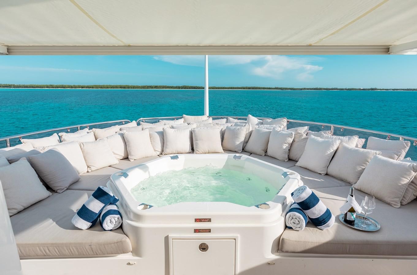a pool with a couch and pillows aboard AQUARIUM Yacht for Sale