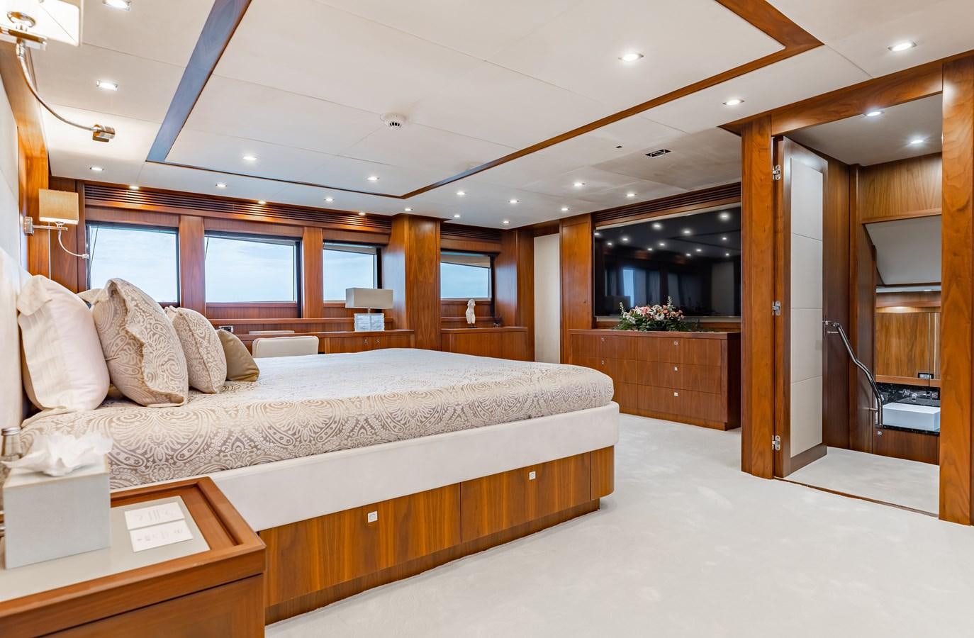 a large bedroom with a large bed aboard AQUARIUM Yacht for Sale