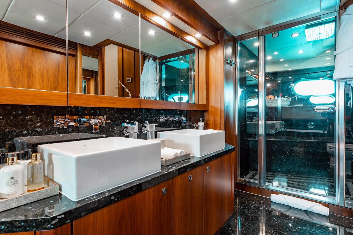 a bathroom with a large glass shower aboard AQUARIUM Yacht for Sale