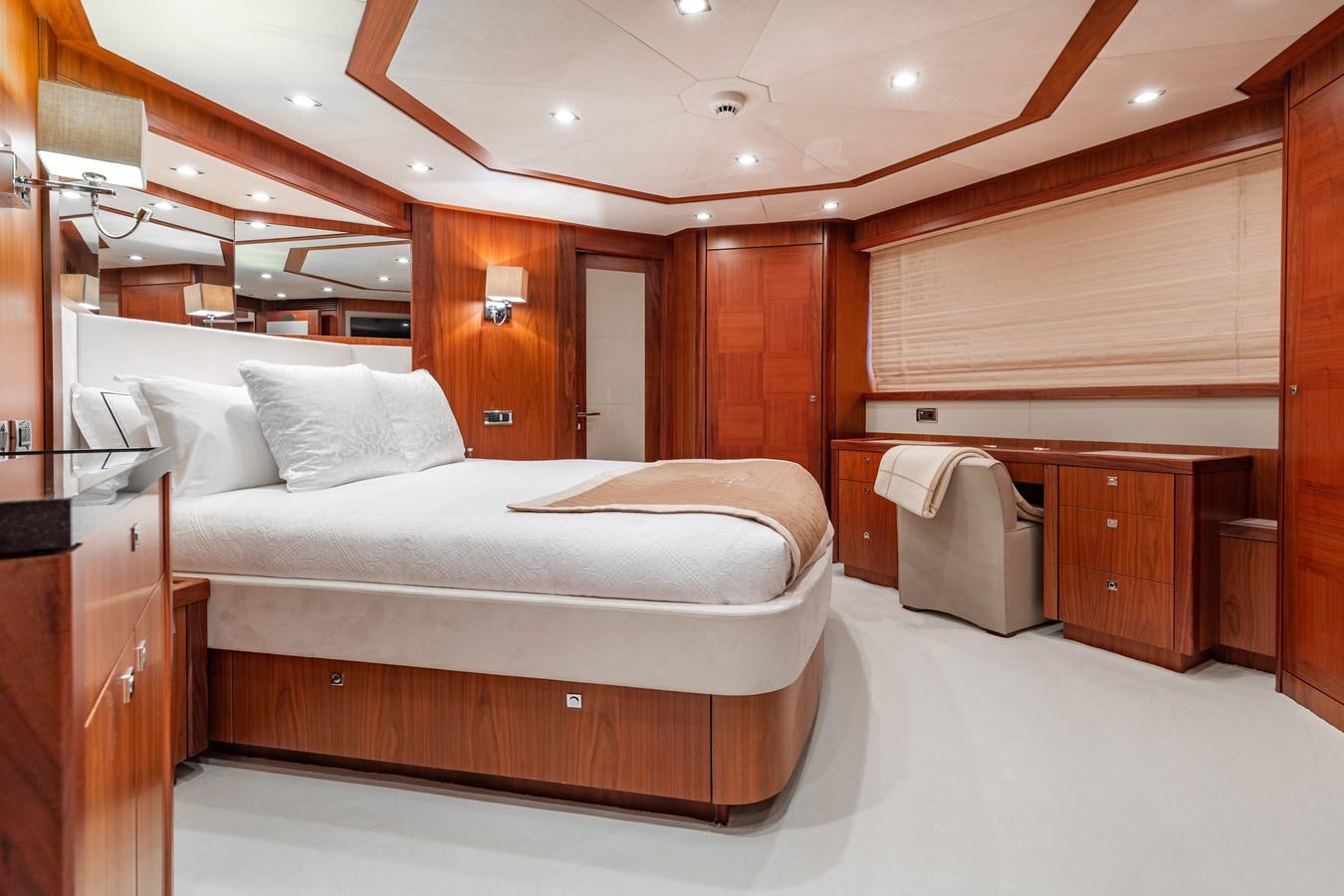 a room with a bed and a desk aboard AQUARIUM Yacht for Sale