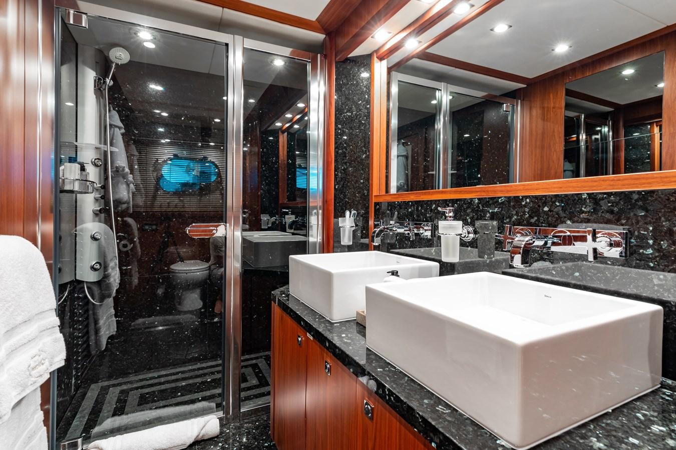 a bathroom with a large mirror aboard AQUARIUM Yacht for Sale