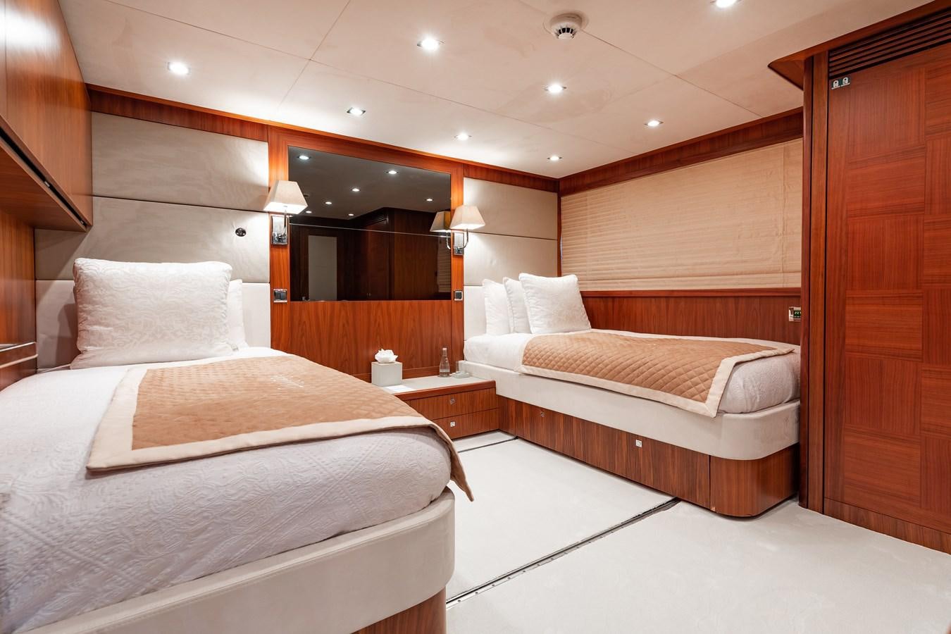 a room with a bed and a mirror aboard AQUARIUM Yacht for Sale
