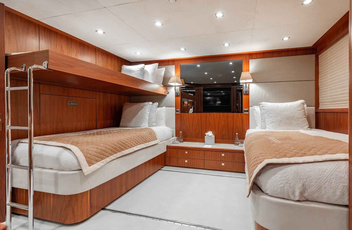 a room with a bed and a television aboard AQUARIUM Yacht for Sale
