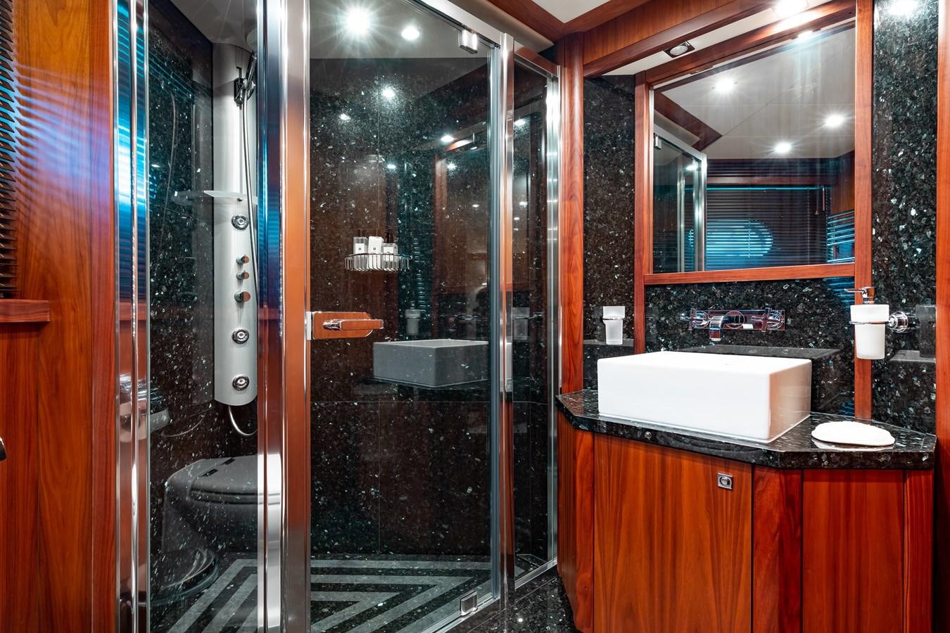 a bathroom with a glass shower aboard AQUARIUM Yacht for Sale