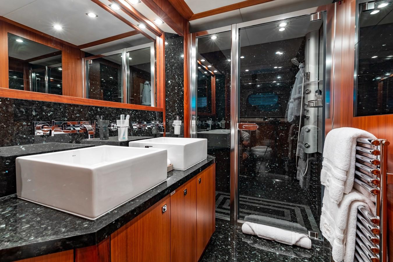 a bathroom with a large mirror aboard AQUARIUM Yacht for Sale