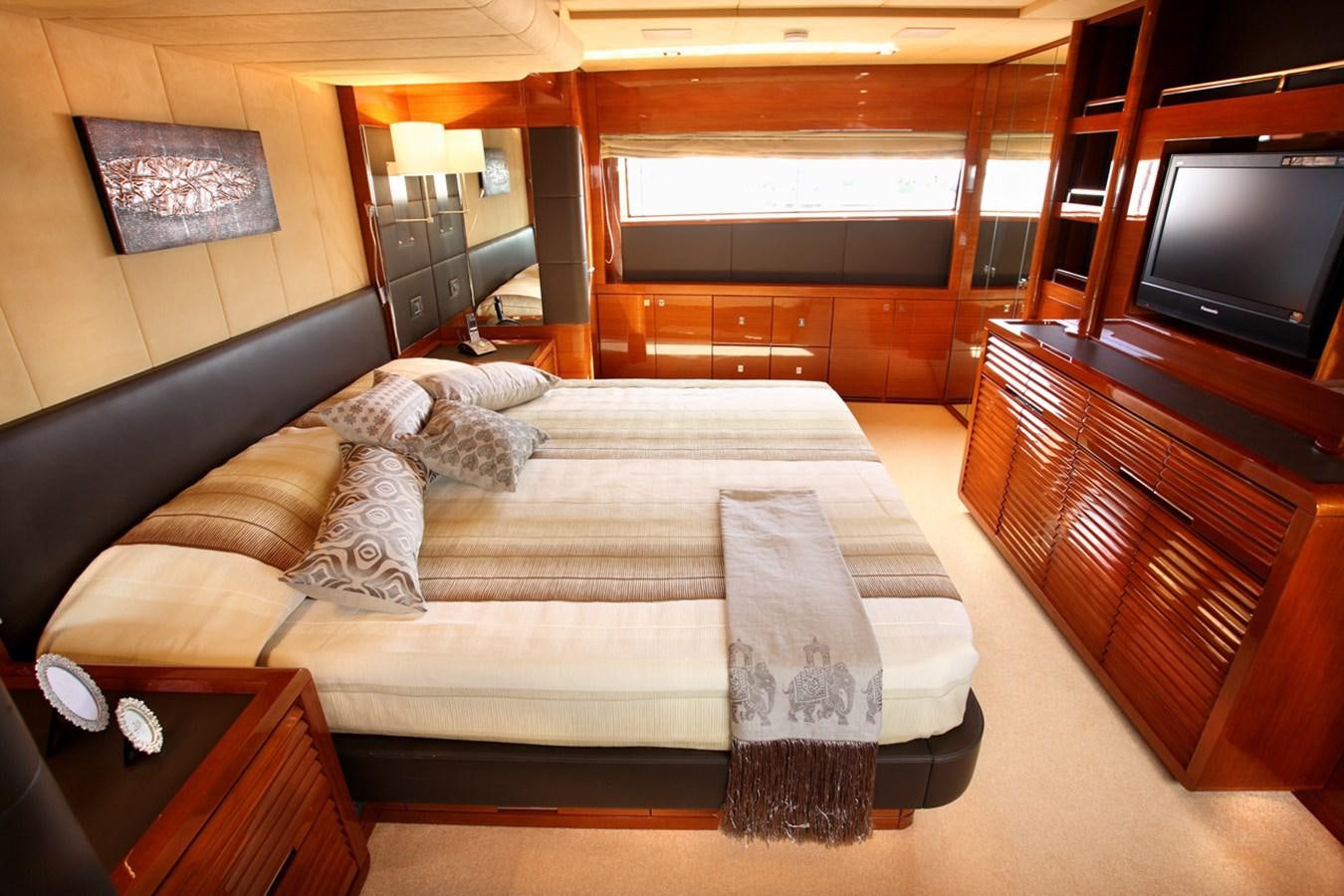a couch in a room aboard XOXO Yacht for Sale
