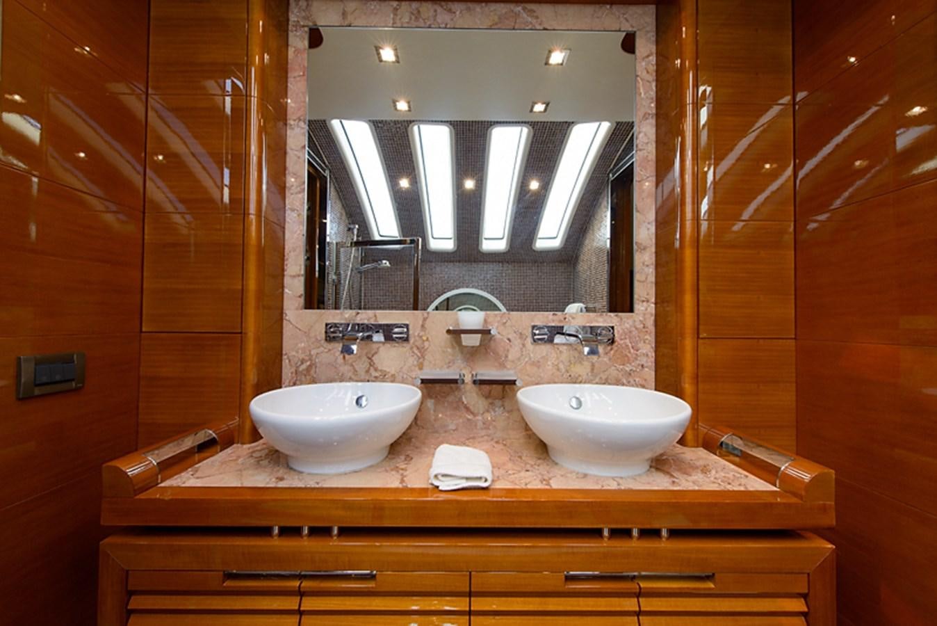 a bathroom with two sinks aboard XOXO Yacht for Sale