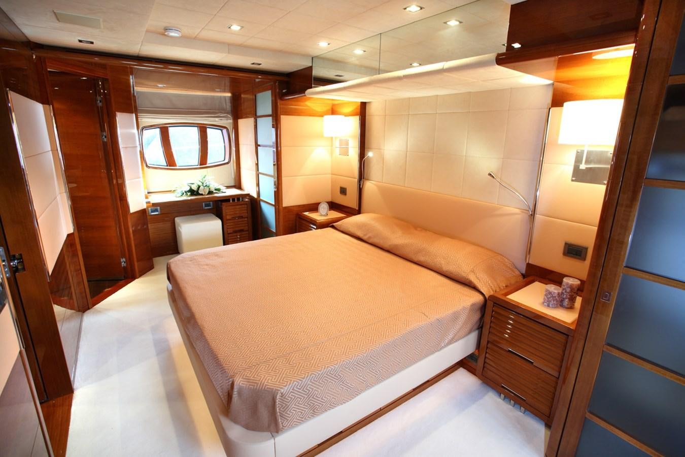 a bed in a room aboard XOXO Yacht for Sale