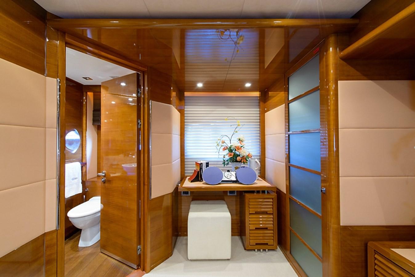 a bathroom with a glass shower aboard XOXO Yacht for Sale