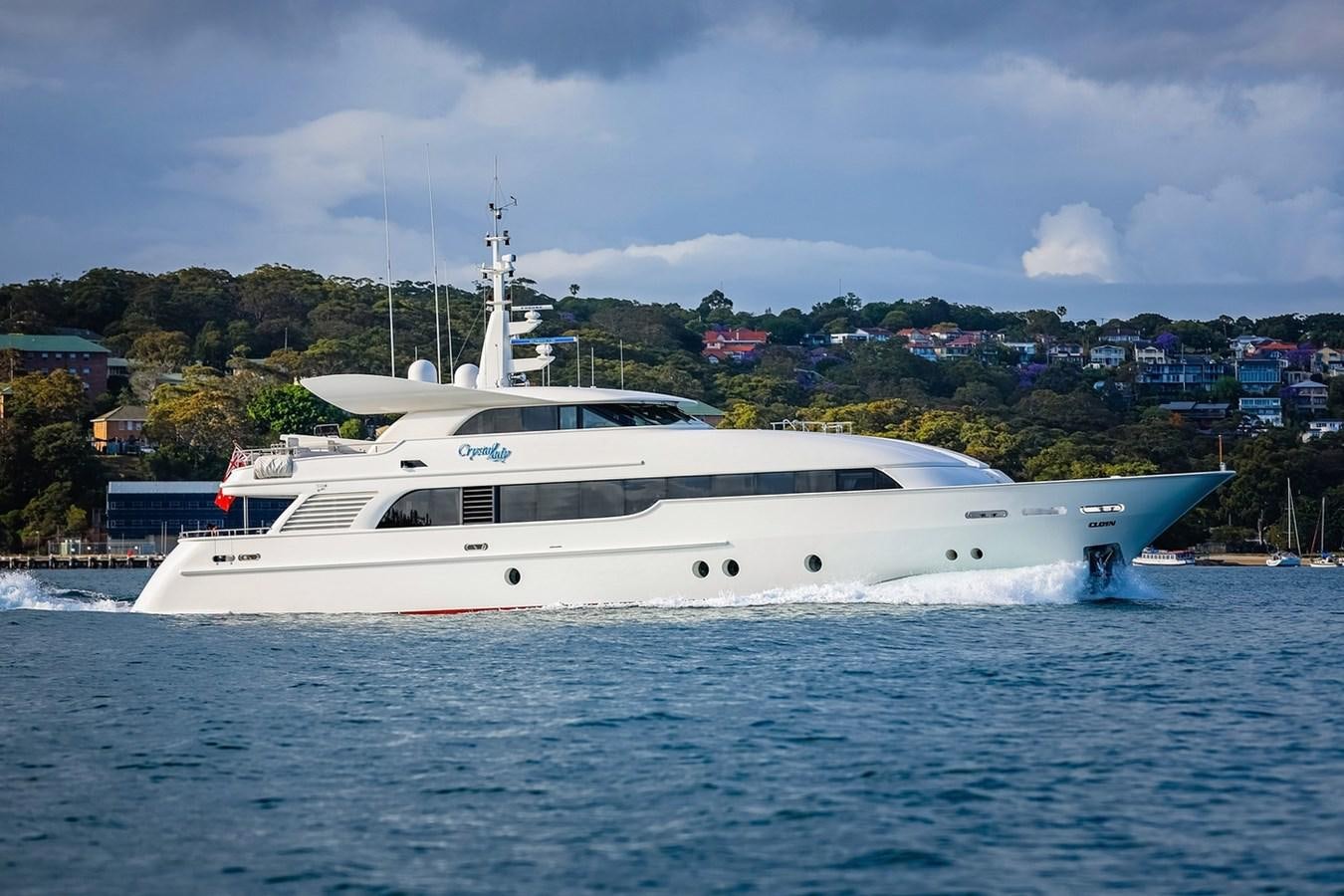 a white yacht in the water aboard CRYSTAL LADY Yacht for Sale