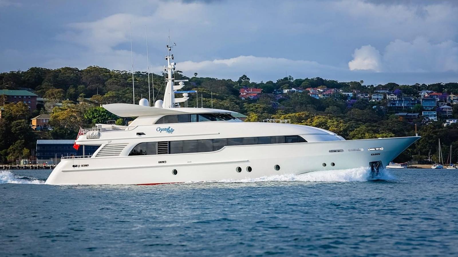 a white yacht in the water aboard CRYSTAL LADY Yacht for Sale