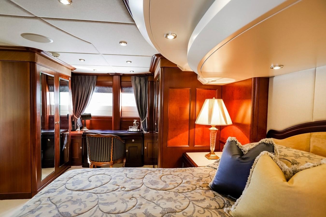 a hotel room with a bed and lamp aboard CRYSTAL LADY Yacht for Sale