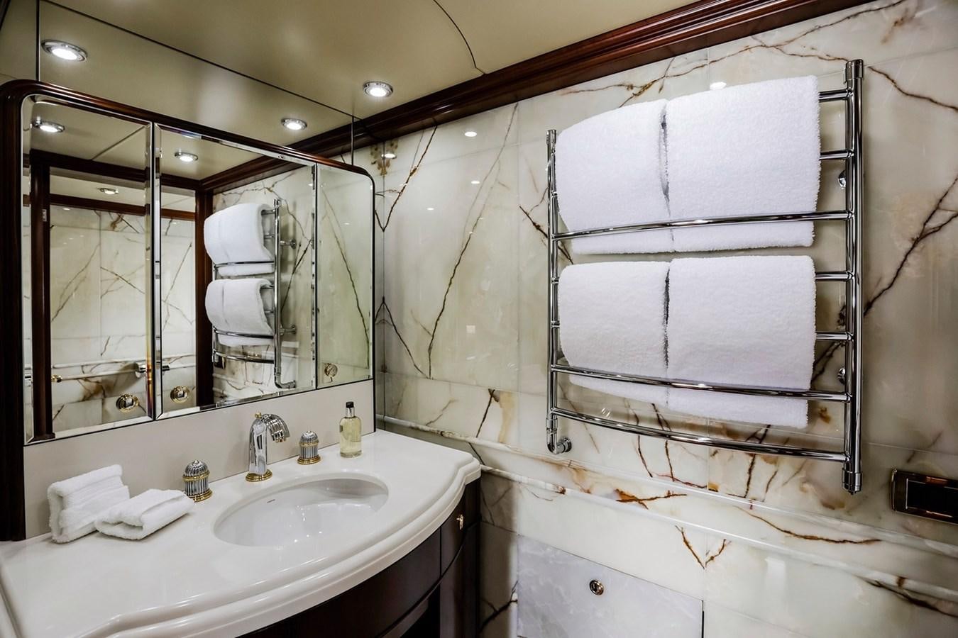 a bathroom with a large mirror aboard CRYSTAL LADY Yacht for Sale