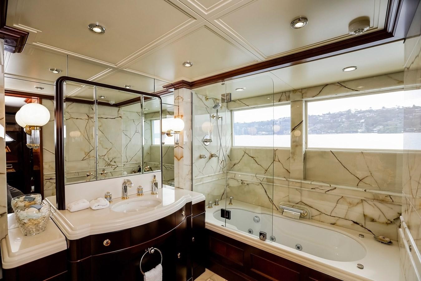 a bathroom with a large tub aboard CRYSTAL LADY Yacht for Sale