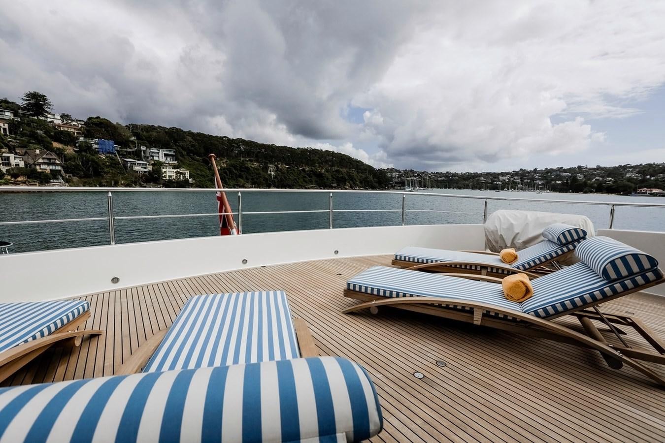 a surfboard and a paddle on a deck aboard CRYSTAL LADY Yacht for Sale