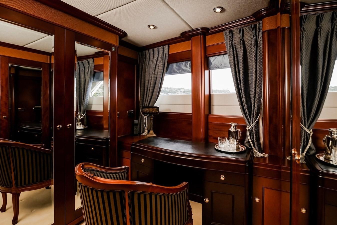 a kitchen with a table and chairs aboard CRYSTAL LADY Yacht for Sale