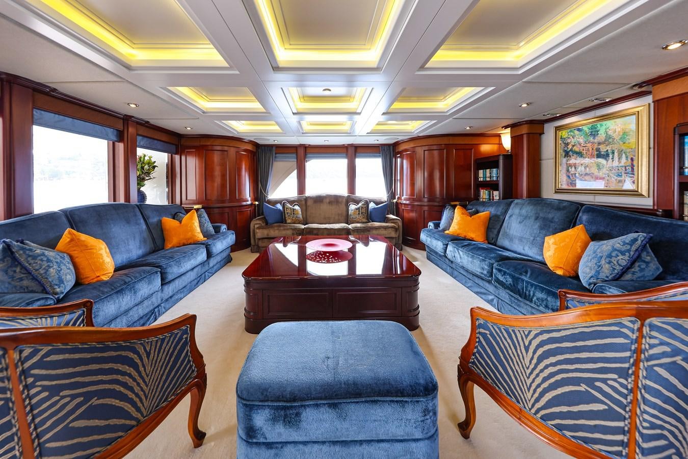 a living room with a leather couch aboard CRYSTAL LADY Yacht for Sale