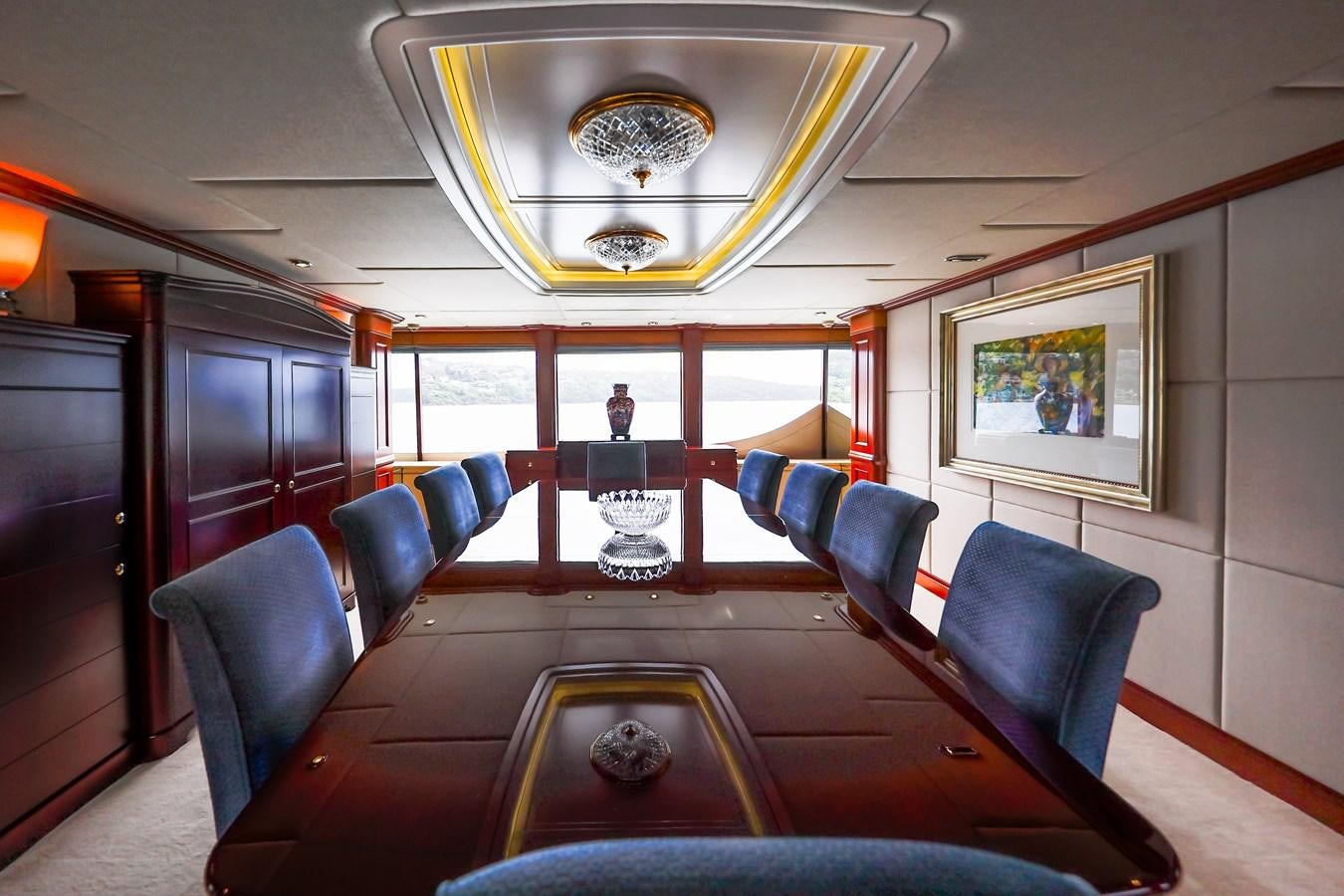 a room with a table and chairs aboard CRYSTAL LADY Yacht for Sale