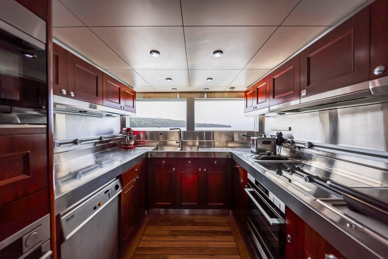a kitchen with a large island aboard CRYSTAL LADY Yacht for Sale