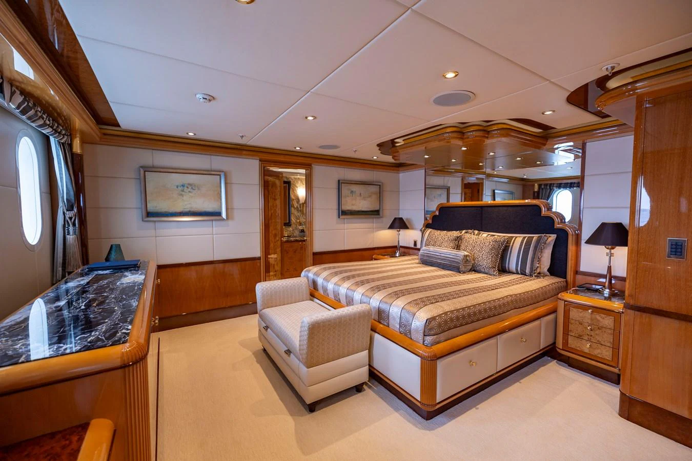 a bedroom with a bed and a dresser aboard ELIS ET MAR Yacht for Sale