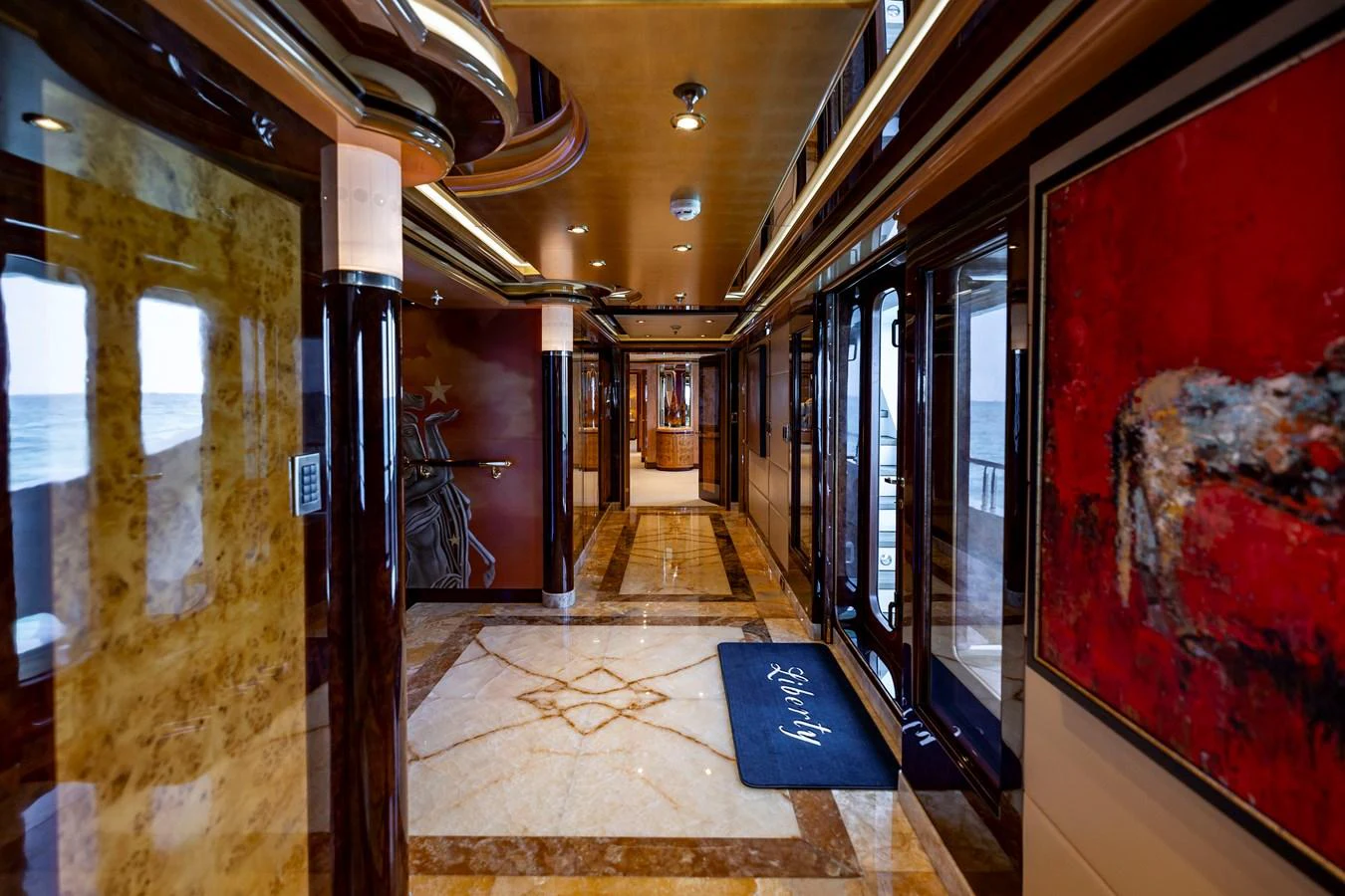 a hallway with a door and a rug on the floor aboard ELIS ET MAR Yacht for Sale