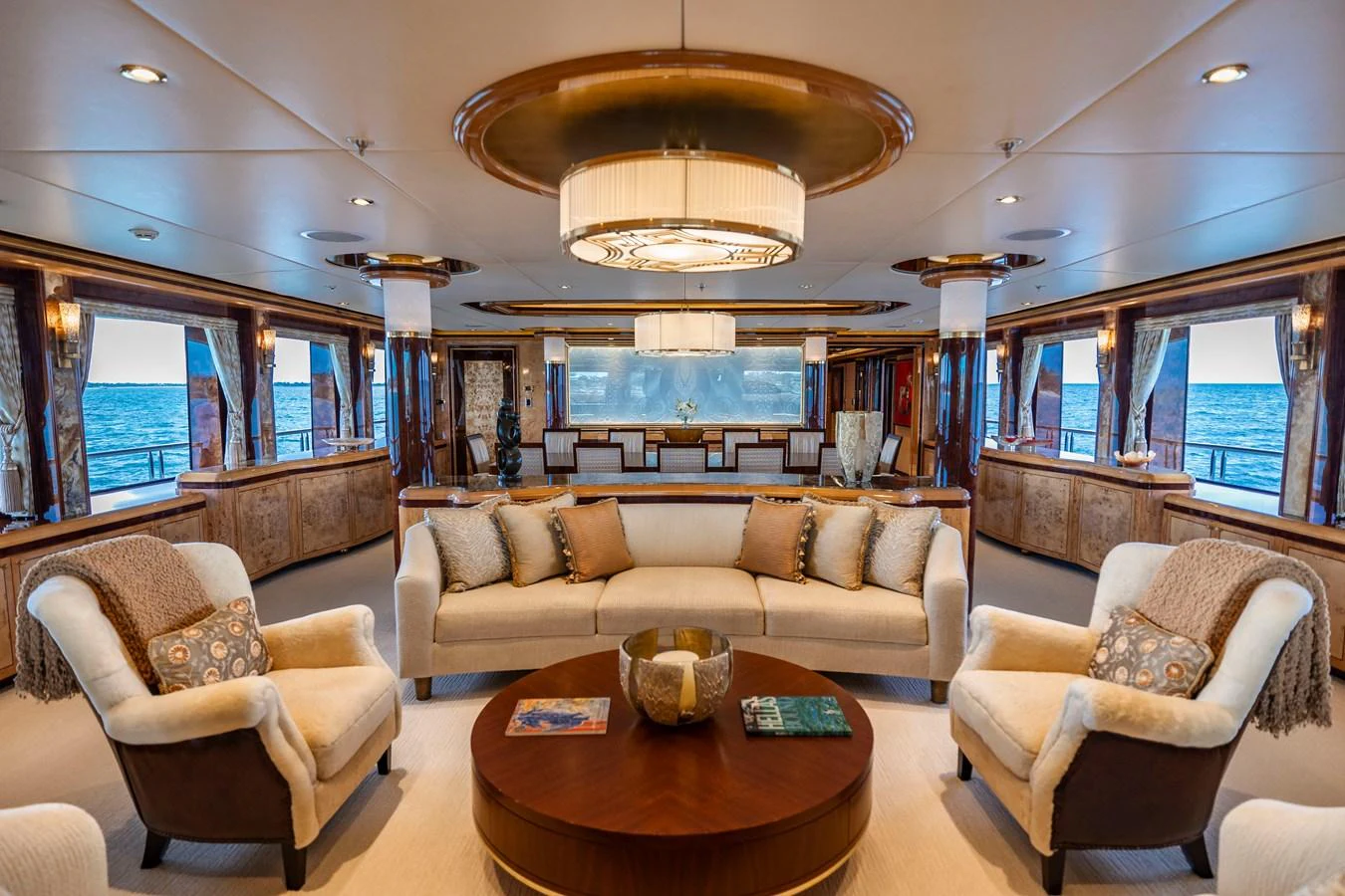 a living room with a large chandelier aboard ELIS ET MAR Yacht for Sale