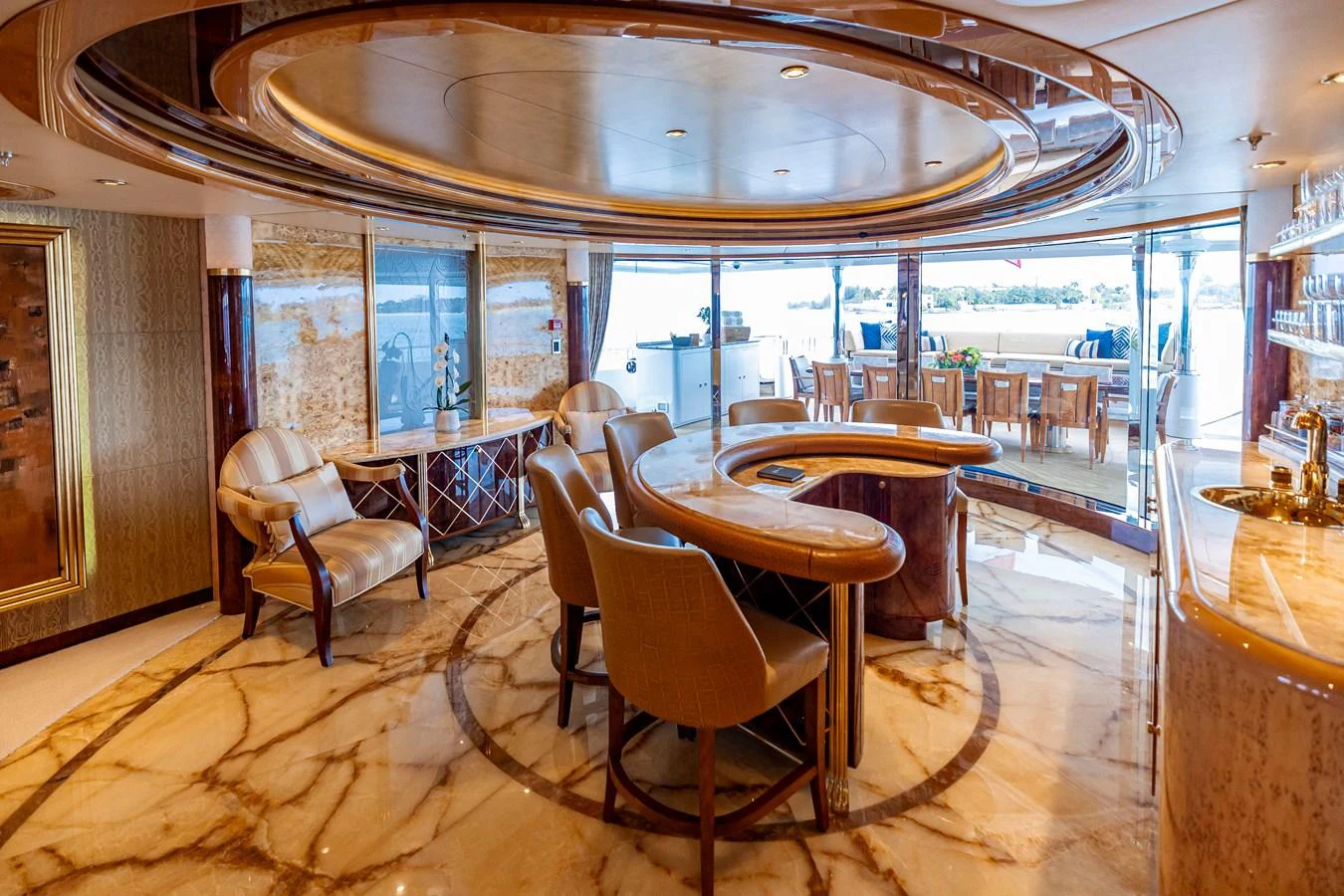 a room with a table and chairs aboard ELIS ET MAR Yacht for Sale