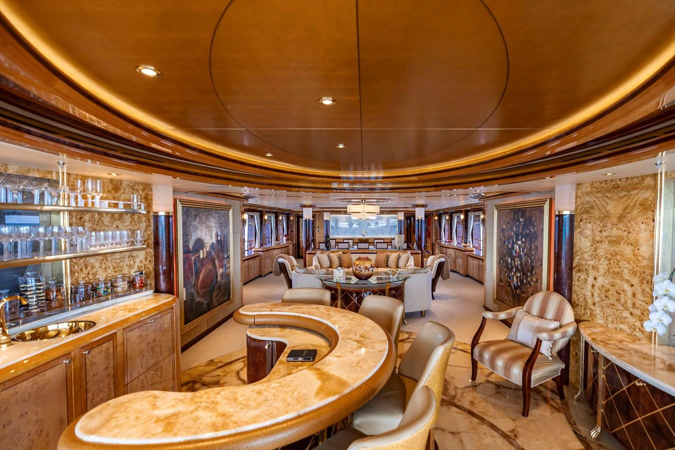 a large room with a table and chairs aboard ELIS ET MAR Yacht for Sale
