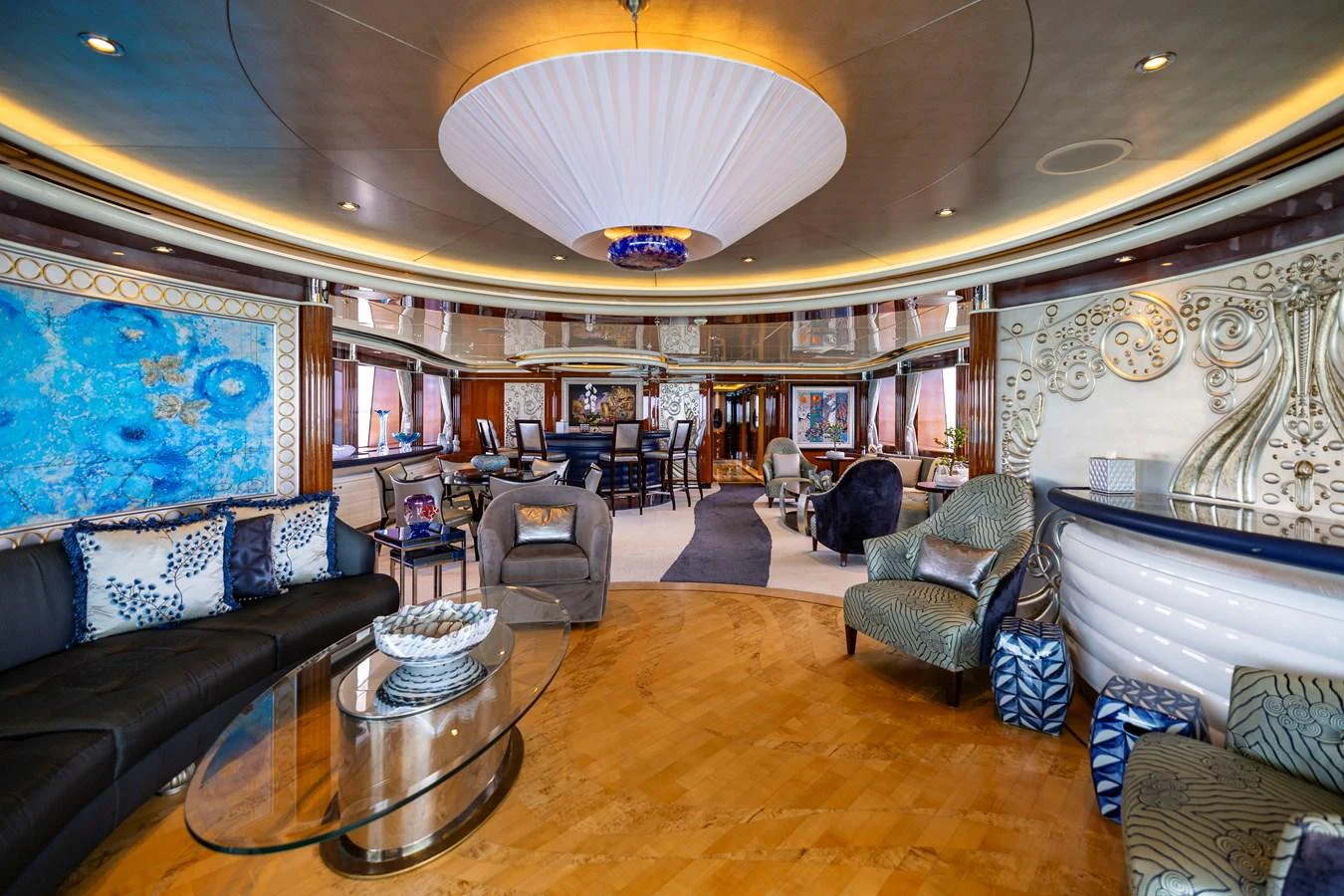 a large living room with a large chandelier aboard ELIS ET MAR Yacht for Sale