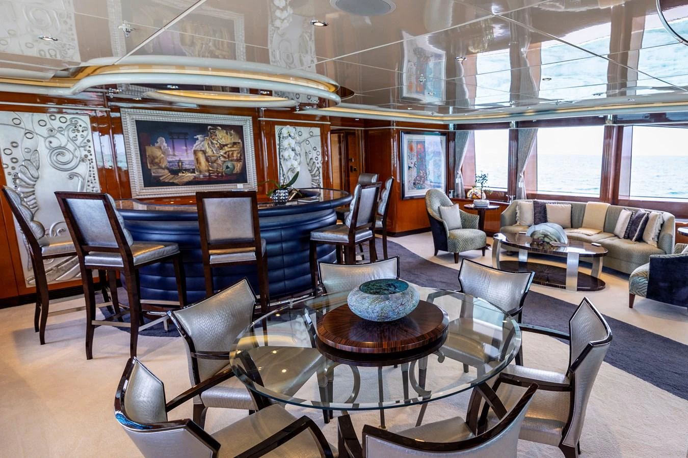 a room with a table chairs and a couch aboard ELIS ET MAR Yacht for Sale