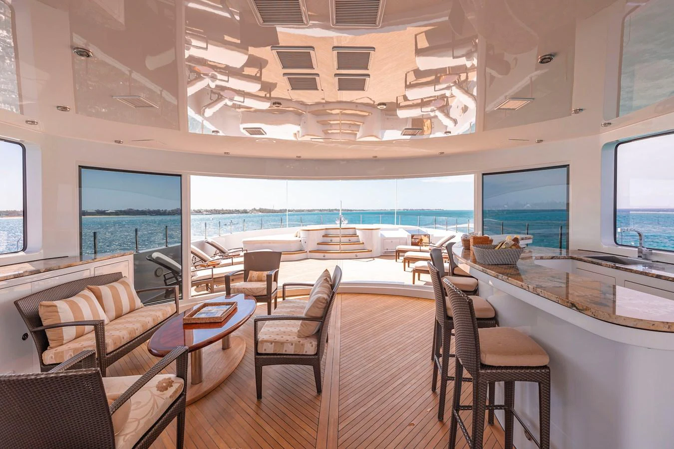 a room with a large table and chairs and a large window aboard ELIS ET MAR Yacht for Sale