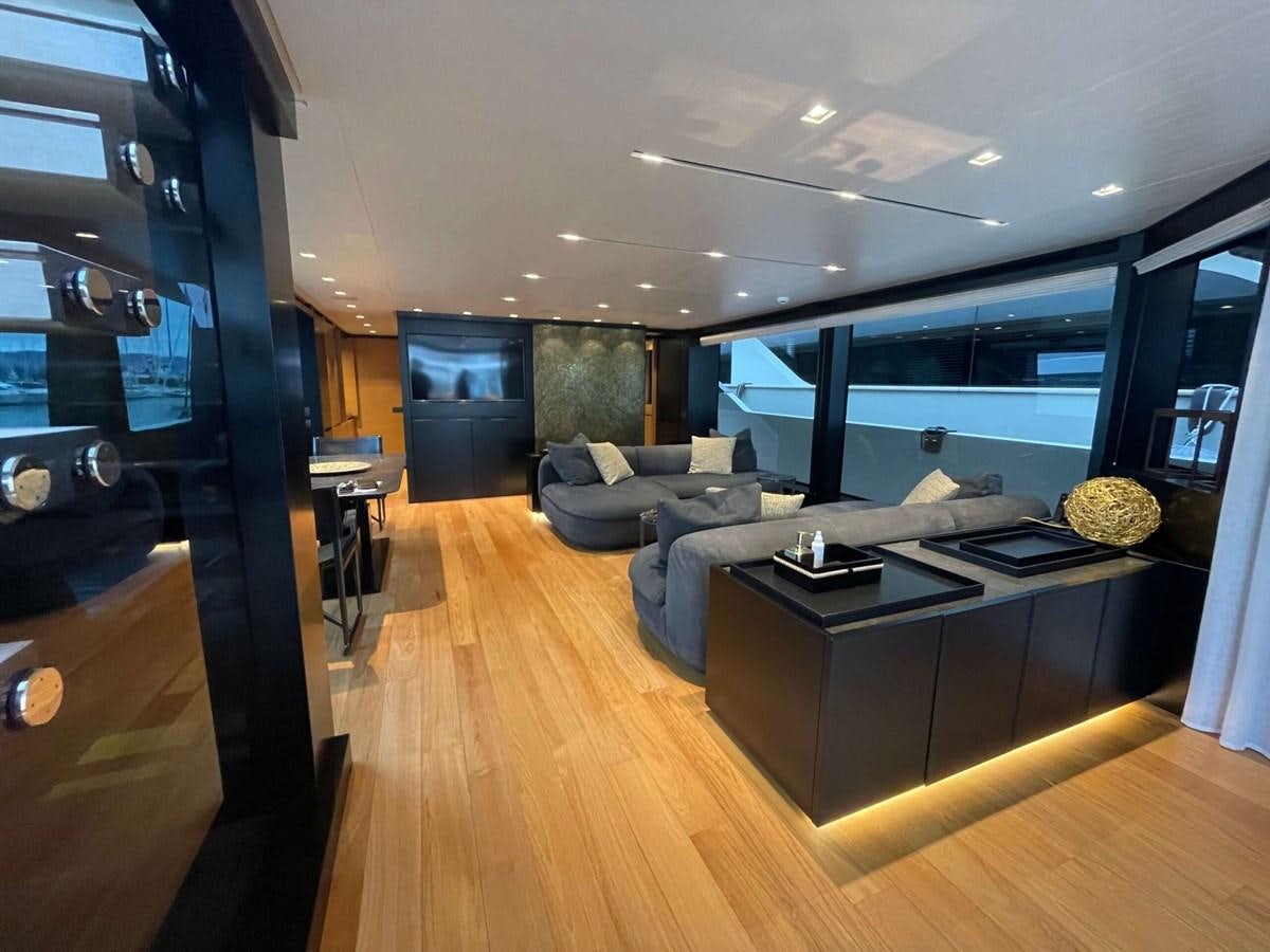 a living room with a wood floor aboard REINE D'AZUR Yacht for Sale