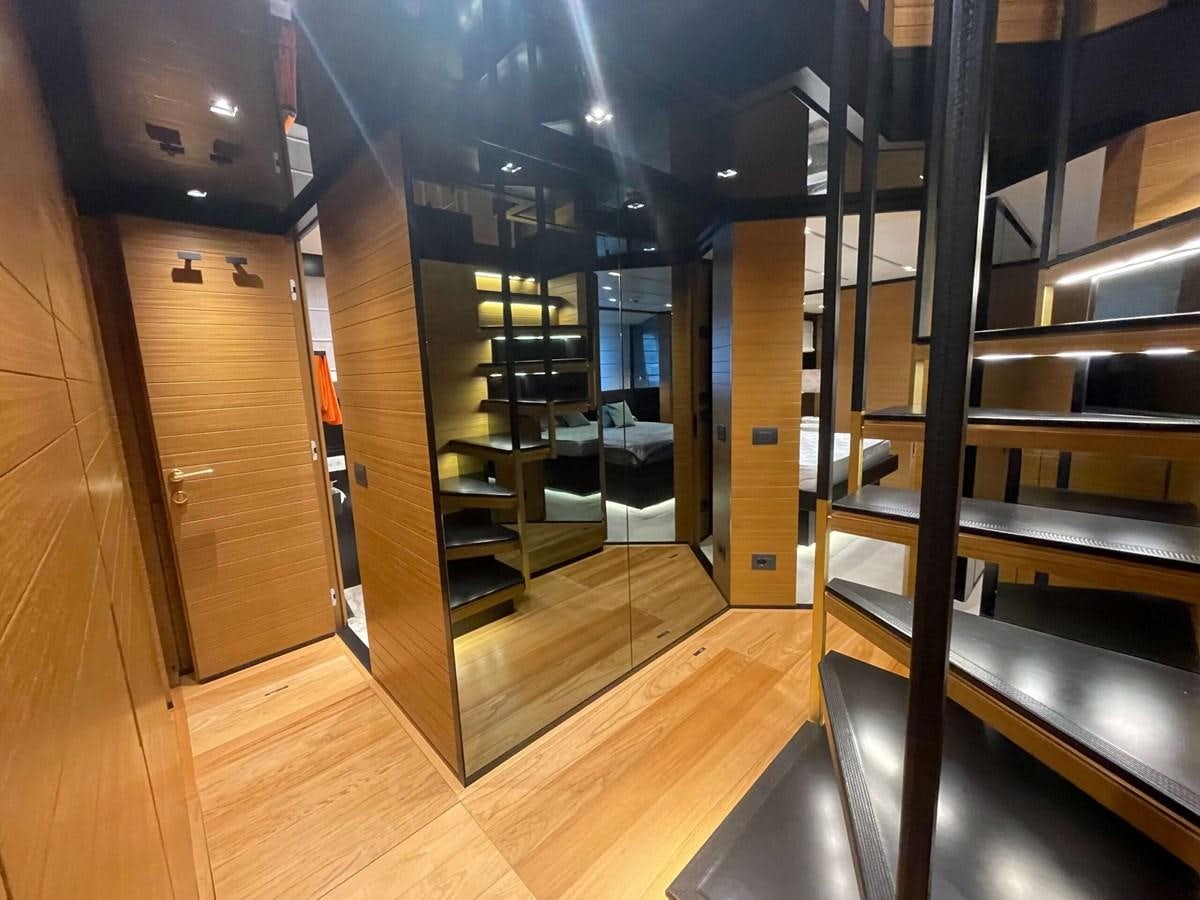 a room with a glass wall and a staircase aboard REINE D'AZUR Yacht for Sale